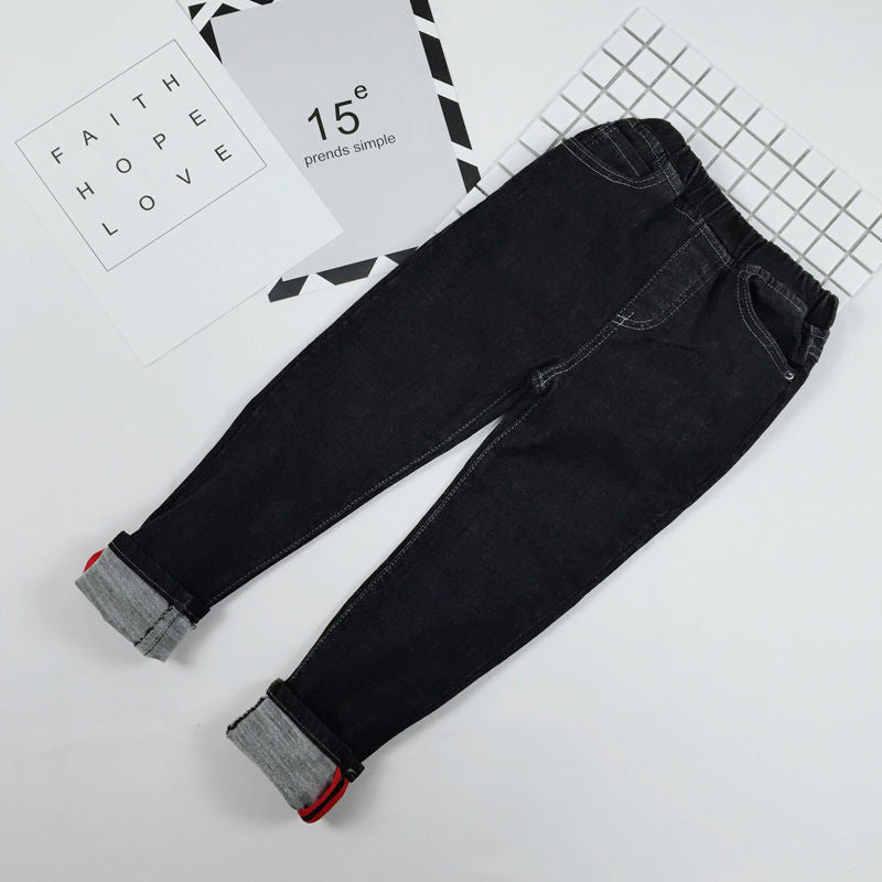 Black jeans with gray cuffs on a white background