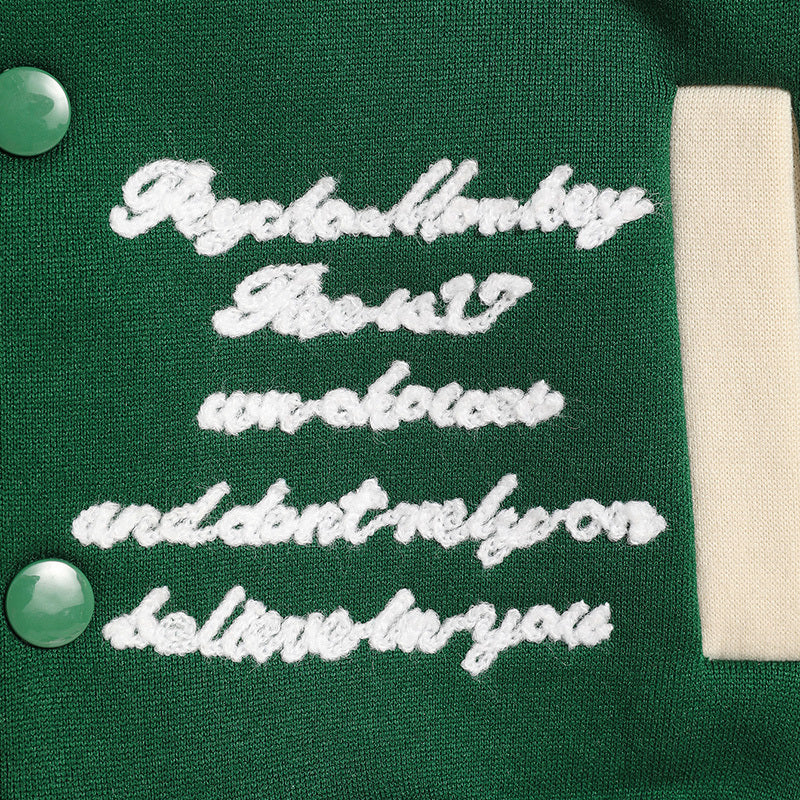 Text on a green background with white embroidery