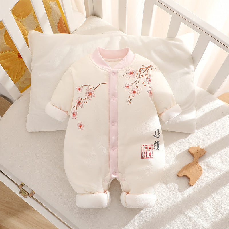 Baby romper with floral design in a crib
