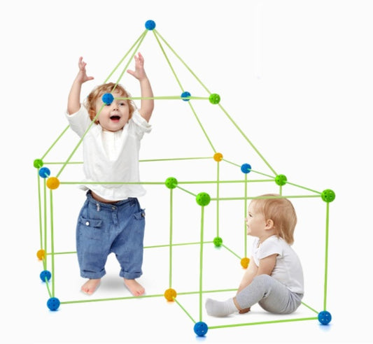 Two children playing with a colorful geometric toy structure on a white background